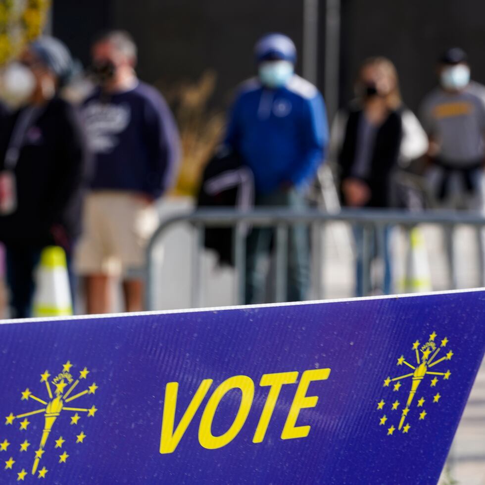 Voters wait in line to cast their ballot in the 2020 Presidential election during early voting in Noblesville, Ind., Wednesday, Oct. 14, 2020.