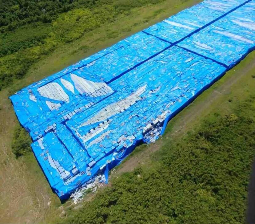 Pallets of bottled water on the runway of the airport José Aponte de la Torre. (Twitter capture)