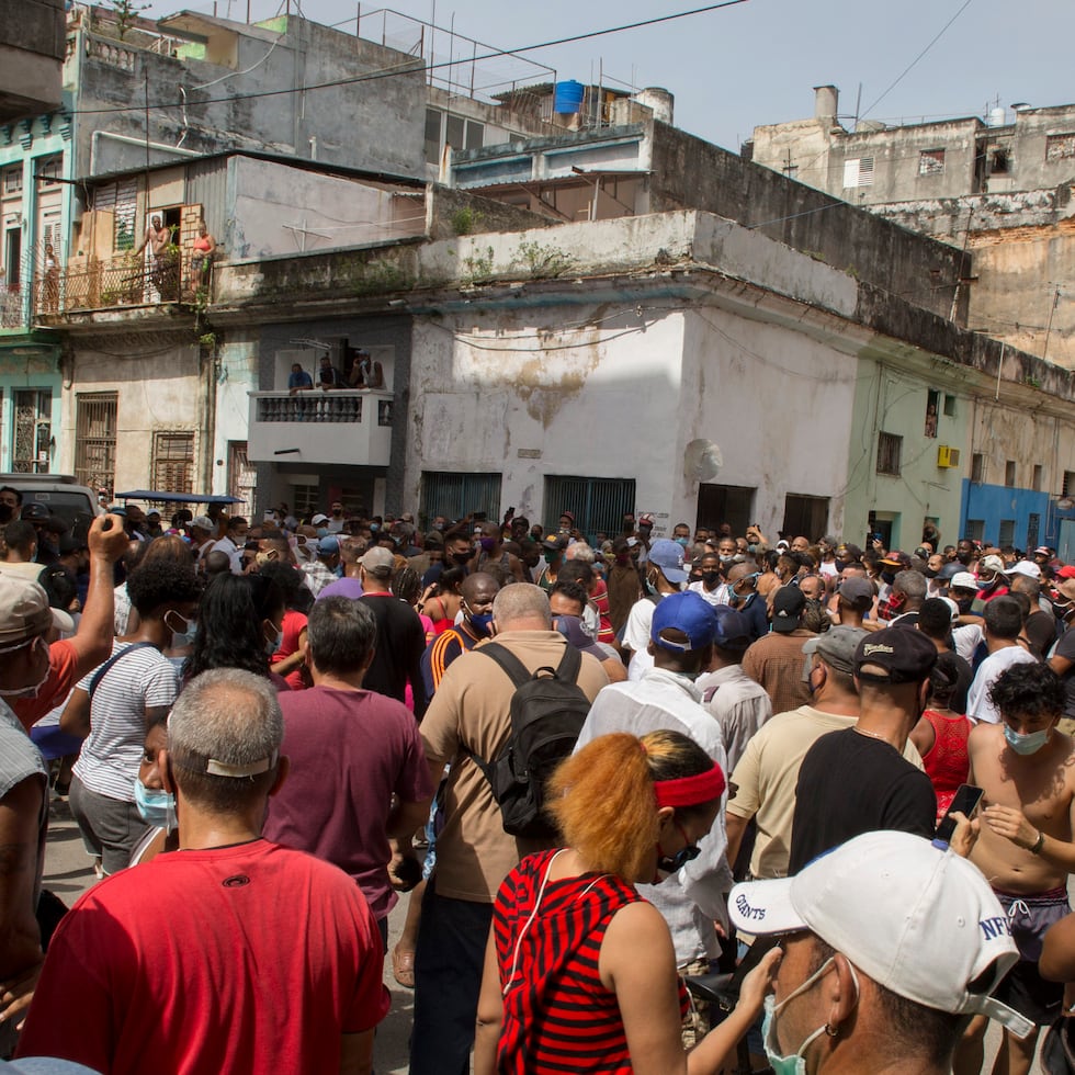 A anti-government protesters march in Havana, Cuba, Sunday, July 11, 2021. Hundreds of demonstrators went out to the streets in several cities in Cuba to protest against ongoing food shortages and high prices of foodstuffs. (AP Photo/Ismael Francisco)