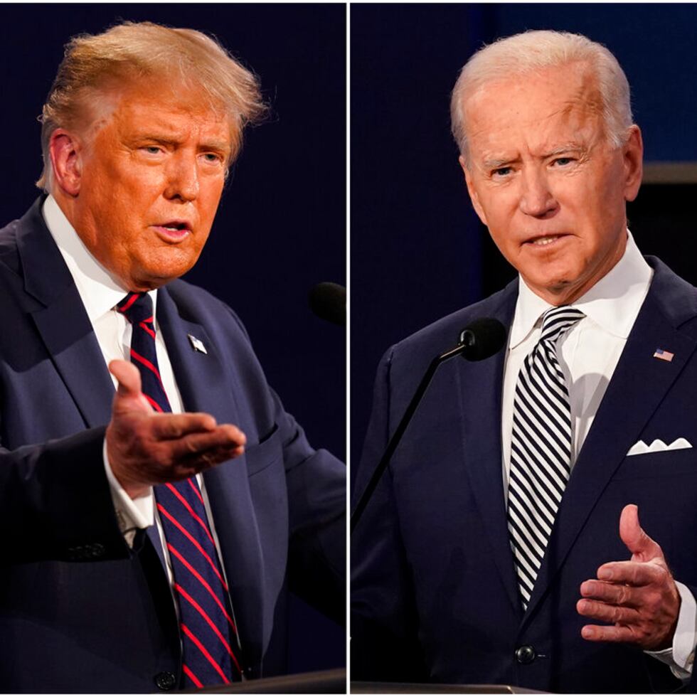 FILE - This combination of Sept. 29, 2020, file photos shows President Donald Trump, left, and former Vice President Joe Biden during the first presidential debate at Case Western University and Cleveland Clinic, in Cleveland, Ohio. (AP Photo/Patrick Semansky, File)