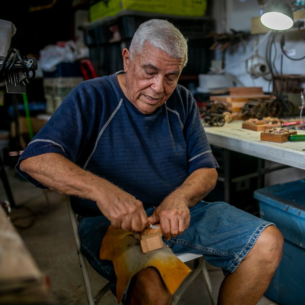Wilzen “Cuco” Pérez, an artisan from Guánica who carves the Three Wise Men and Saints out of wood in his workshop.
